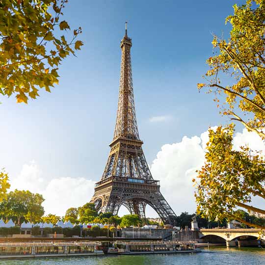The Eiffel Tower in Paris, with the Seine in the foreground